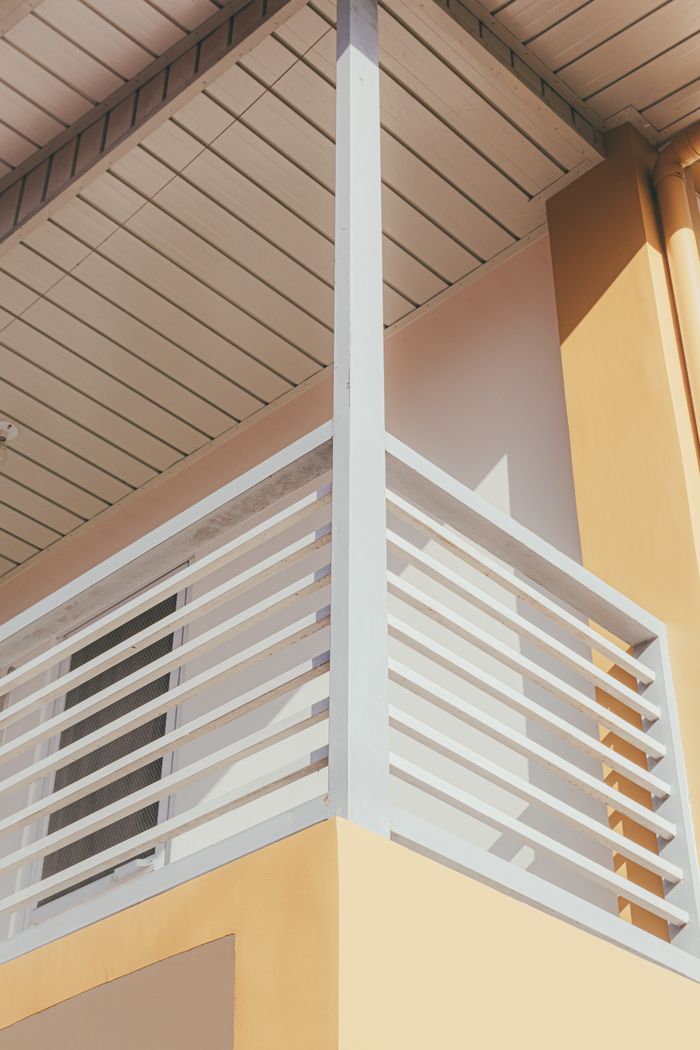 A modern, minimalist balcony with clean lines and geometric design showcases architectural elegance.